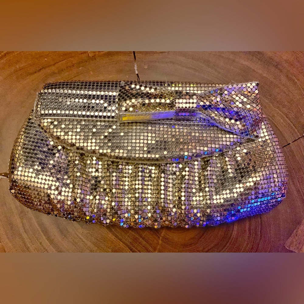 Felix grey metallic clutch with bow